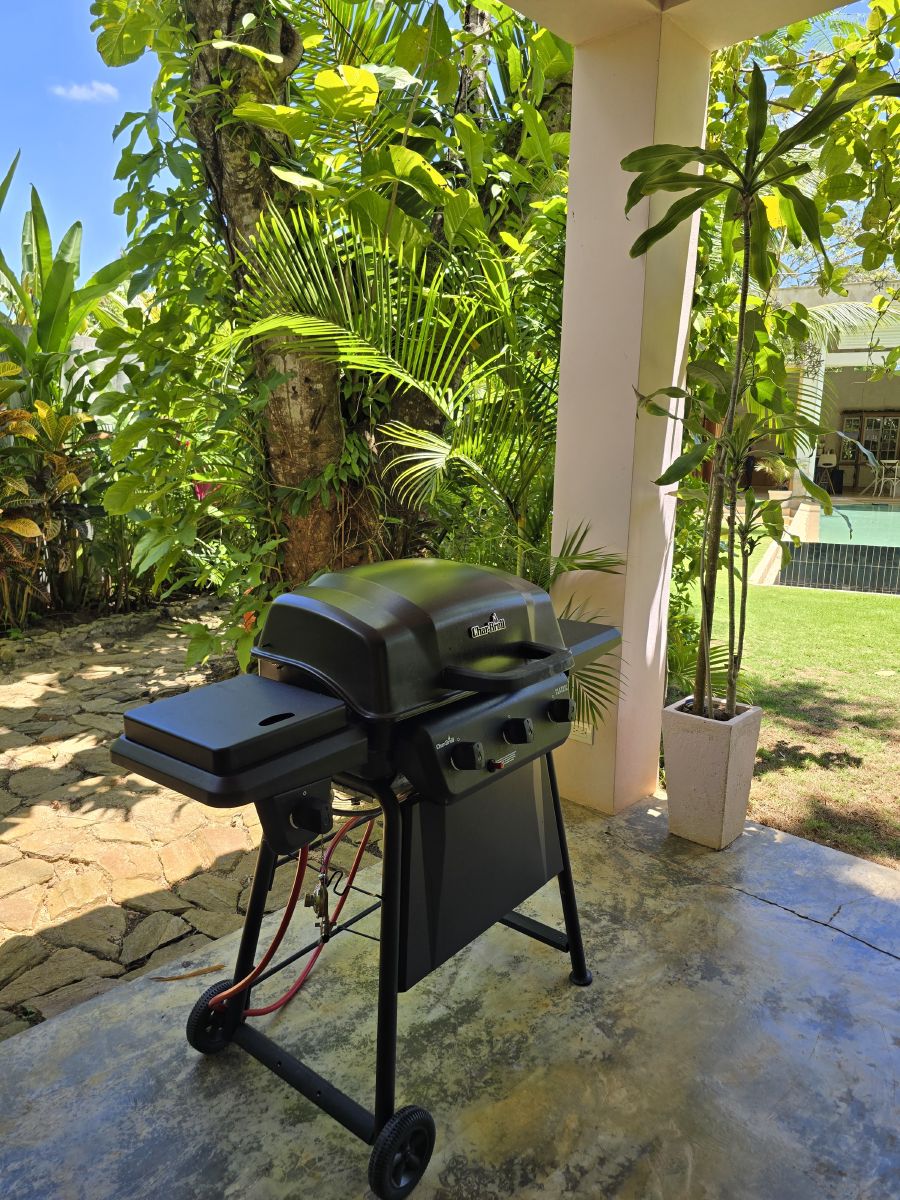 The gas grill on the covered terrace